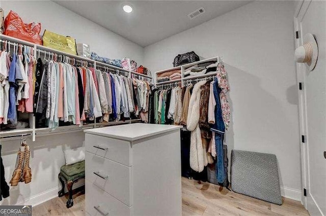 walk in closet featuring light wood-type flooring