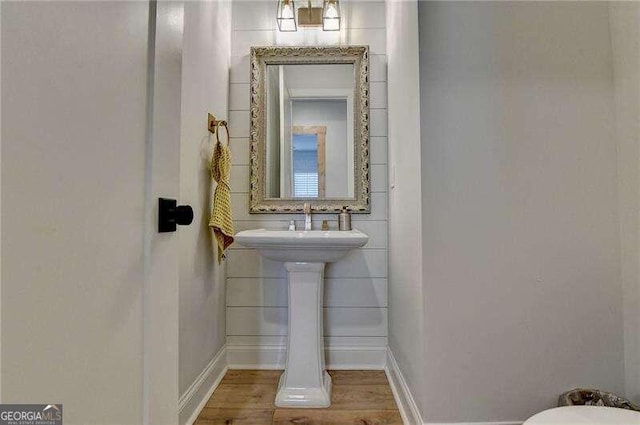 bathroom with hardwood / wood-style flooring