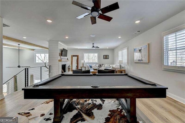 game room with plenty of natural light, light hardwood / wood-style floors, and pool table