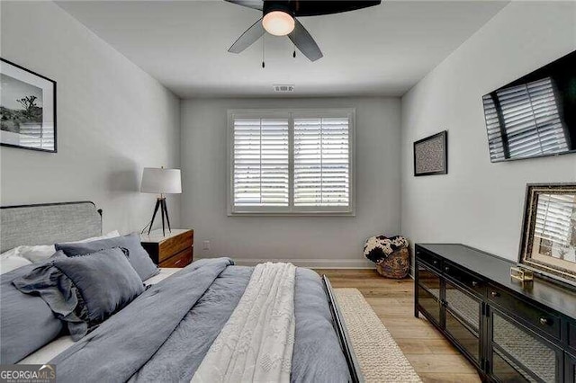 bedroom featuring light wood-type flooring and ceiling fan