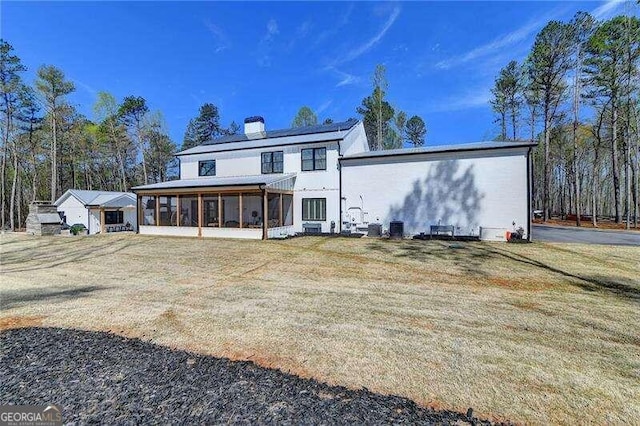 back of property featuring a sunroom