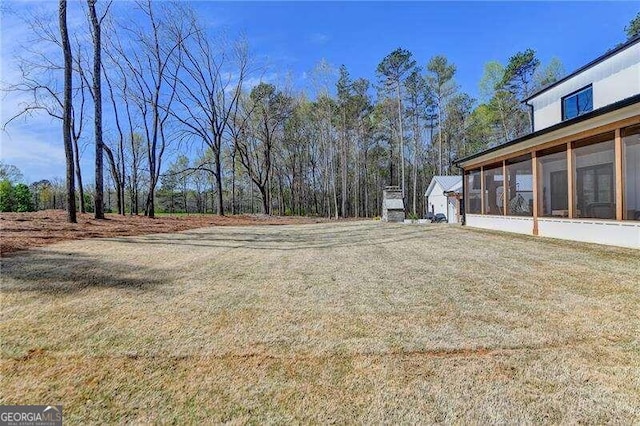 view of yard with a sunroom