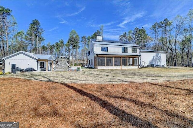 view of front of home with a sunroom