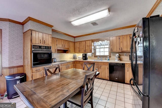 kitchen with black appliances, crown molding, sink, a textured ceiling, and light tile patterned flooring