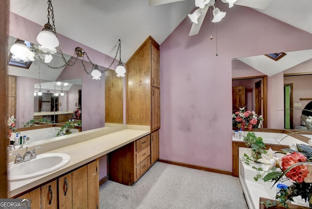 bathroom featuring vanity, ceiling fan, and lofted ceiling