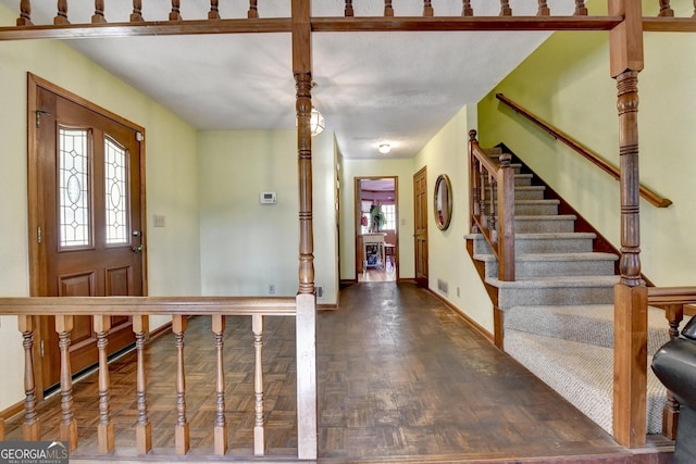 foyer entrance featuring dark wood-type flooring