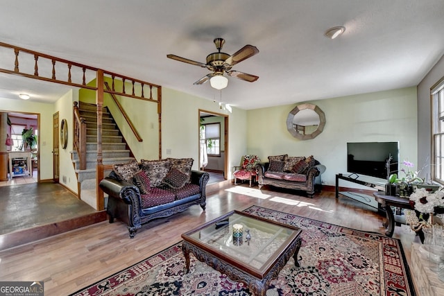 living room featuring ceiling fan, a healthy amount of sunlight, and hardwood / wood-style flooring