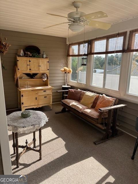 sunroom featuring ceiling fan and a healthy amount of sunlight