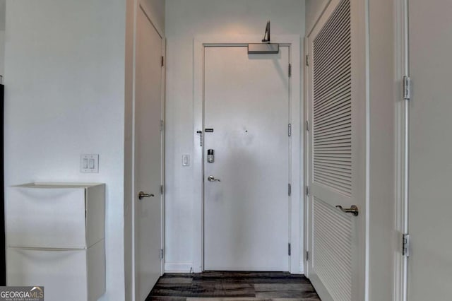 corridor with dark wood-type flooring