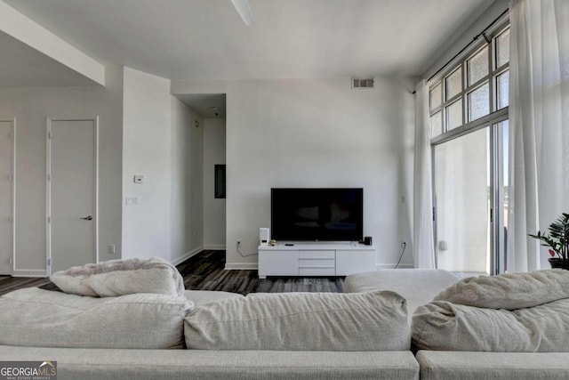 living room with dark hardwood / wood-style flooring