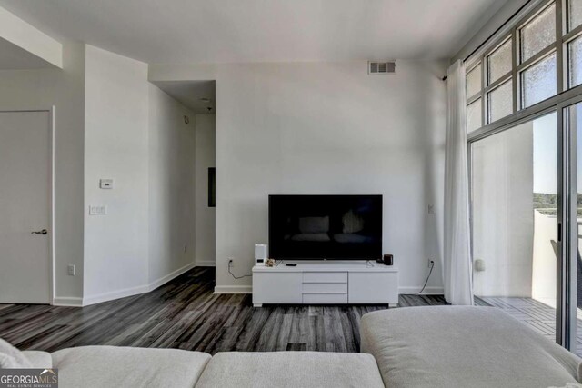 living room with dark wood-type flooring