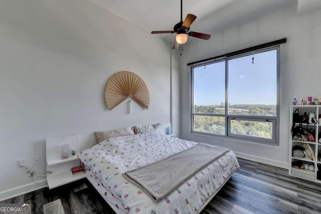 bedroom featuring dark hardwood / wood-style floors and ceiling fan