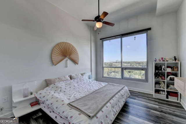 bedroom featuring ceiling fan and dark wood-type flooring