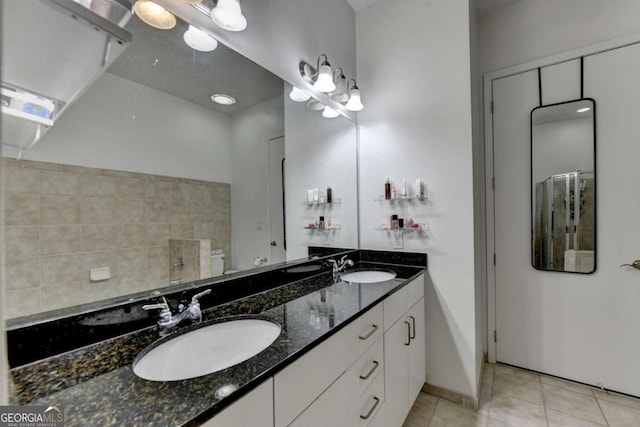 bathroom with tile patterned floors and vanity