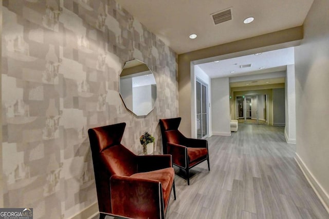 sitting room featuring hardwood / wood-style floors