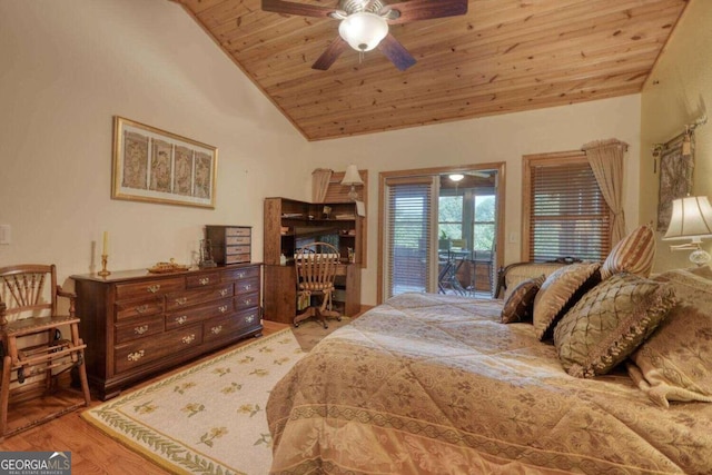 bedroom featuring ceiling fan, hardwood / wood-style flooring, wooden ceiling, vaulted ceiling, and access to outside