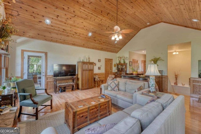 living room featuring ceiling fan, light hardwood / wood-style flooring, high vaulted ceiling, and wooden ceiling