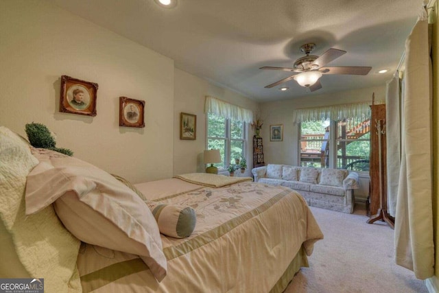 carpeted bedroom featuring ceiling fan