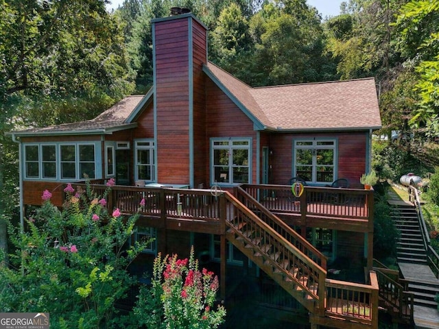 back of house with a wooden deck