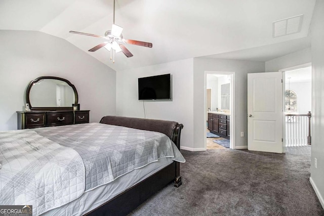 carpeted bedroom featuring ceiling fan, ensuite bath, and vaulted ceiling