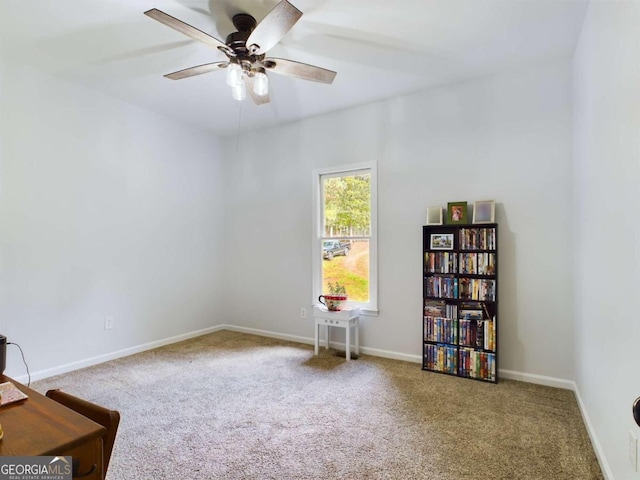 interior space with ceiling fan and carpet flooring