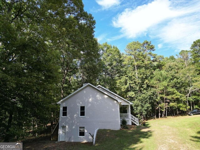 view of home's exterior with a lawn