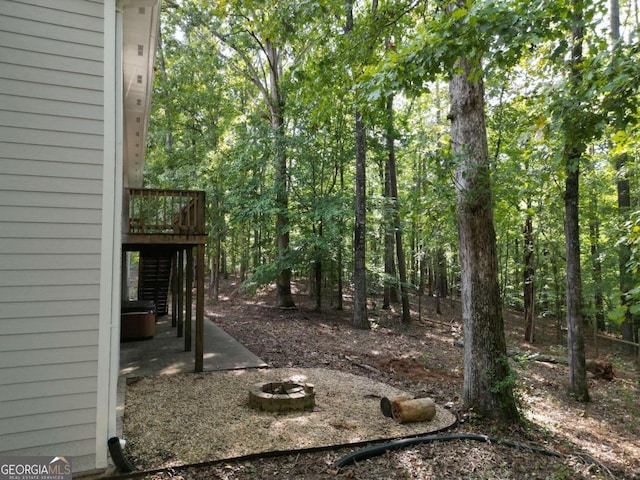 view of yard featuring a patio and a wooden deck