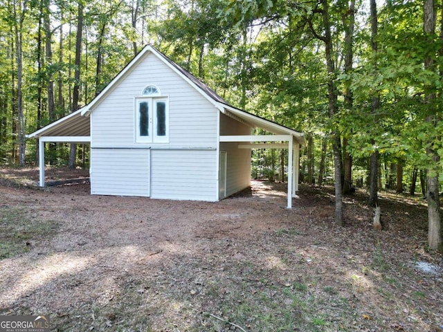 view of property exterior featuring an outdoor structure