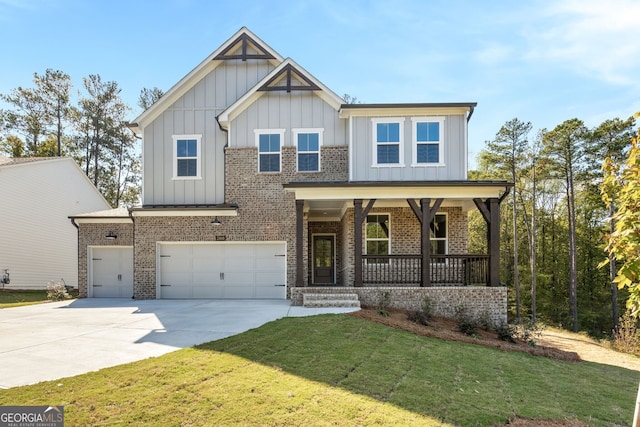 craftsman-style house with a garage, a front lawn, and covered porch