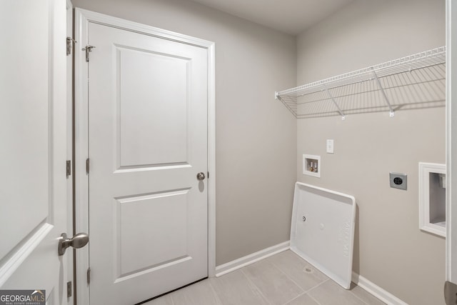 washroom with washer hookup, light tile patterned floors, and electric dryer hookup