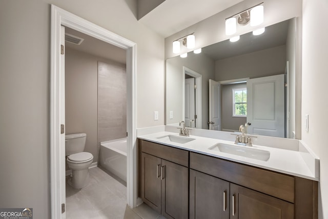 bathroom featuring tile patterned floors, vanity, and toilet