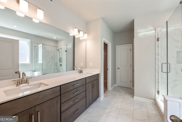 bathroom featuring vanity and a shower with shower door