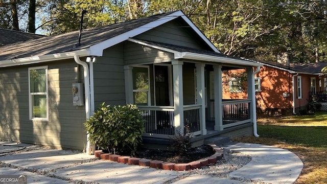 view of outdoor structure with covered porch