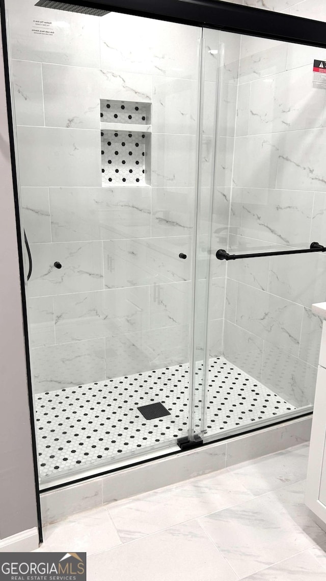 bathroom featuring an enclosed shower