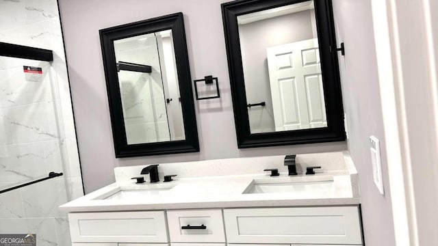 bathroom featuring vanity and tiled shower