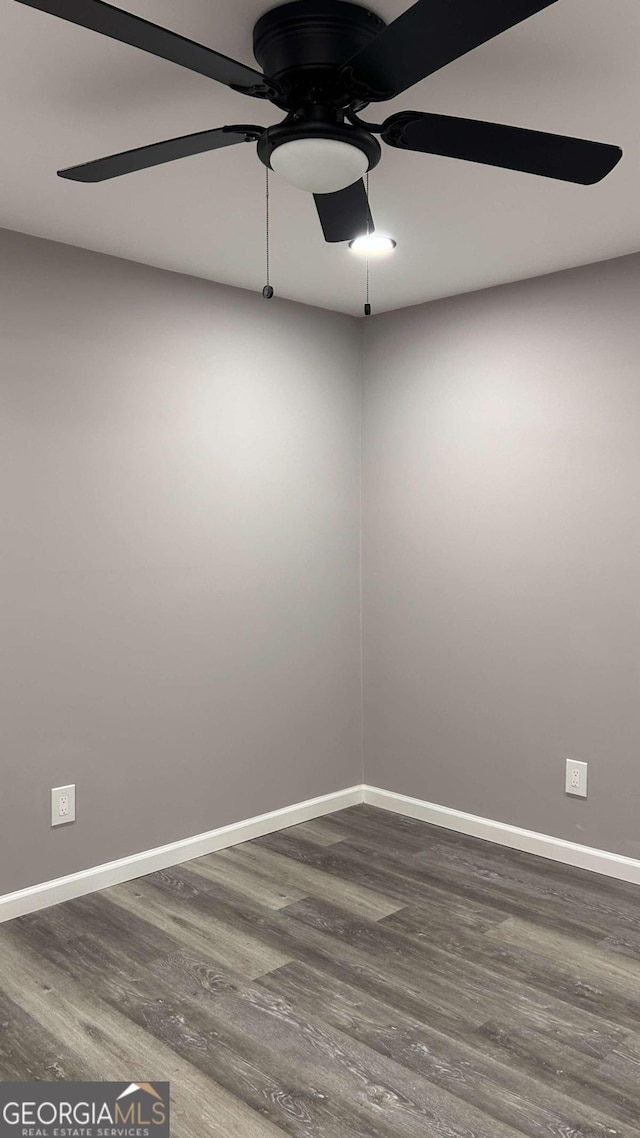 empty room featuring hardwood / wood-style flooring and ceiling fan