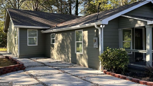 view of property exterior with a patio