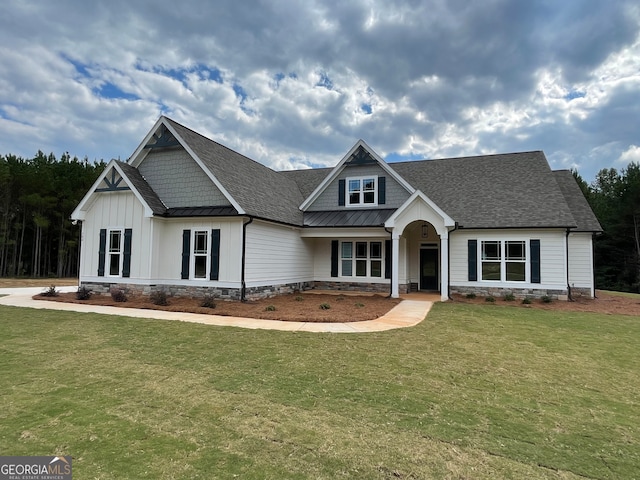 craftsman inspired home with a front yard