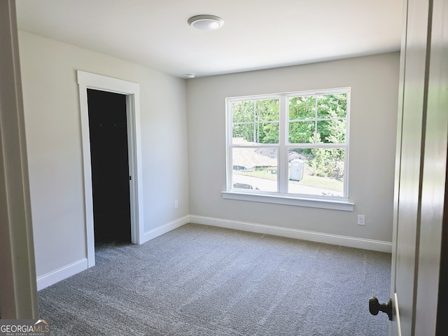 spare room with carpet flooring