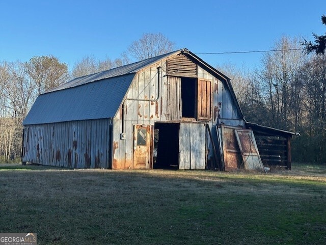 view of outdoor structure with a lawn