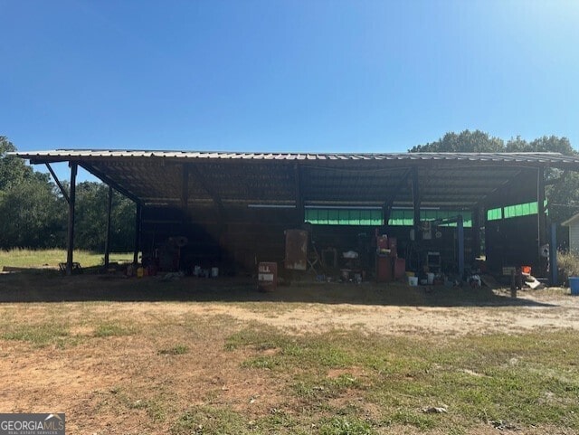 view of outbuilding featuring a yard