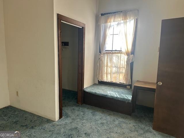 unfurnished room featuring light colored carpet