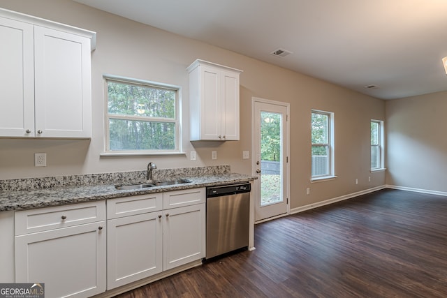 kitchen featuring sink, light stone counters, dark hardwood / wood-style flooring, stainless steel dishwasher, and white cabinets