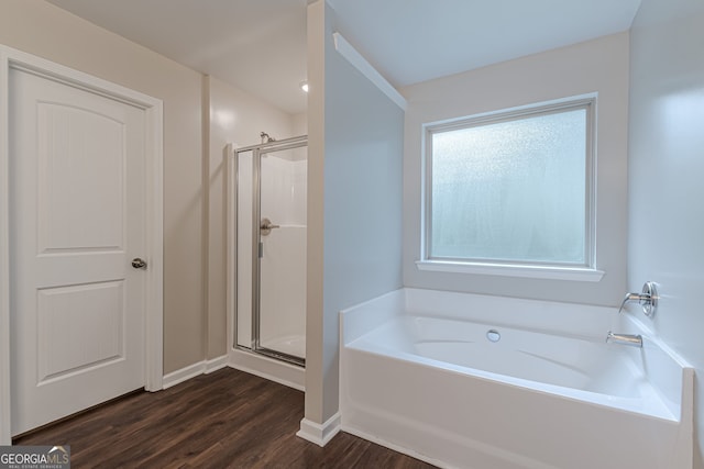 bathroom with hardwood / wood-style floors and plus walk in shower