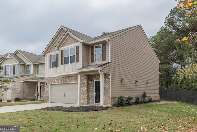 view of front of home with a garage and a front yard