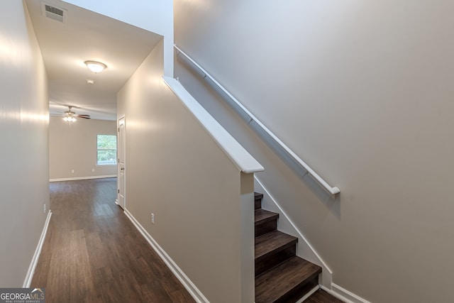 stairs with ceiling fan and wood-type flooring