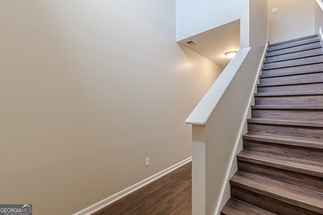 stairs with hardwood / wood-style floors