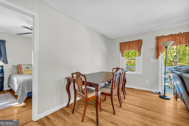 dining area with ceiling fan and light wood-type flooring