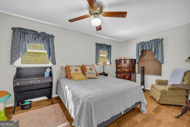 bedroom featuring ceiling fan and hardwood / wood-style floors