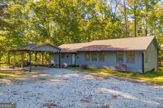 ranch-style home featuring a carport